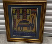 Front view of framed tapestry showing design and frame