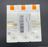 Front view showing three sealed boxes with branding and SPF information