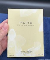 Front of boxed perfume showing brand and volume