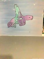 Full view of acrylic board showing stylized marine animal artwork with signature