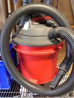 Craftsman wet/dry vacuum front view with hose attached