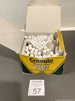 Open Crayola box showing partial quantity of white chalk sticks
