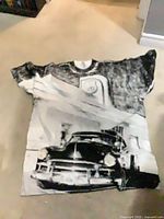 Front view of T-shirt laid flat showing full graphic