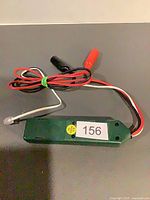 Module showing housing, wiring, alligator clips, RJ11 plug