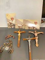 Group shot showing rosaries, crucifixes, prayer cards