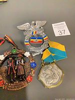All three medals showing overall designs and ribbons