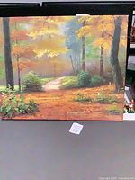 Full view of painting showing autumn forest path scene