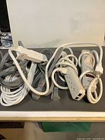 All cords and power strips coiled together on tabletop