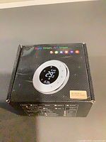 Front of retail box showing thermostat image and model label
