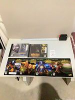 Overview of six Blizzard PC game discs on table