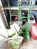 Overall view of lot showing two green handles, fabric bag, chute panels