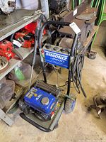 Overall view of Simoniz S2900 pressure washer with hose and wand