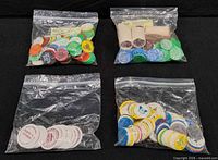 Four bags of assorted plastic tokens and two coin rolls