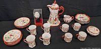 Full set including coffee pot, creamer, sugar, mugs, plates, bowls, display egg