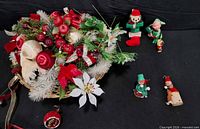 Group showing floral basket and five ornaments