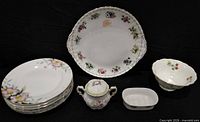 Full lot showing plates, platter, sugar bowl, bowl, dish