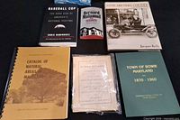 All eight books laid out showing covers