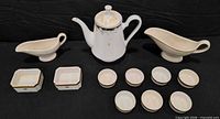 Full view of entire 13-piece porcelain set