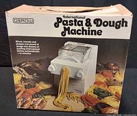Retail box front showing Osrow International Pasta & Dough Machine graphics and branding