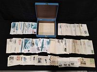 overall view of blue box and spread of first day cover envelopes