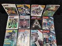 Front view displaying all twelve Pro! magazines in three rows of four