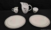 Full lot overview showing two platters, lidded coffee pot, creamer, teacup