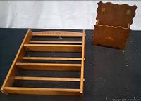 Spice rack and mail holder displayed on black surface