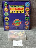 Album front cover and storage box full of slammers