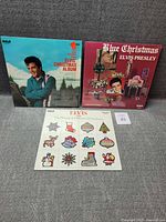 Front covers of all three Elvis Christmas LPs