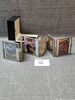 Full multifold photo display set up with sample cards inside and storage box shown