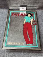 Full view of mirrored picture showing design, frame and overall condition