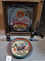 Overall shot showing illuminated mirror sign, tray, two sealed bottles