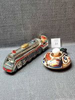 Locomotive and saucer side by side