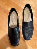 Top view of both shoes showing leather uppers and Clarks insoles