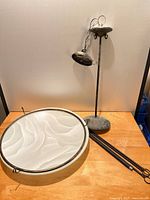 Fixture components including frosted glass diffuser, suspension rods and pendant assembly