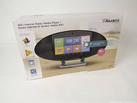 Front of retail box showing product image, 7-inch touchscreen, WiFi and 10 W info