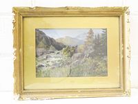 Front view of framed painting showing landscape scene and full frame