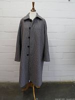 Front view of full-length tweed overcoat on mannequin