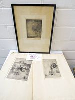 Overview showing framed etching and two loose etchings laid out