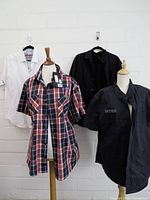 Four shirts displayed: white Robert Graham, red plaid Harley-Davidson with tags, black Harley-Davidson, plain black shirt