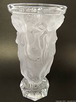 Full view of vase front showing frosted body, relief figures, clear rim, octagonal base