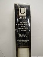 Close-up of Umbra box front with product name and size 36 in x 72 in
