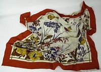 Full scarf showing floral print and red border