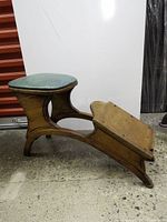 Full profile of hardwood shoe shine bench showing seat and footrest