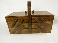 Closed wooden cantilever sewing box