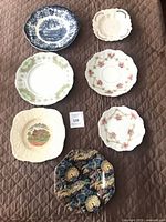 Group shot showing all seven plates laid out