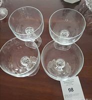 Top view showing four coupe bowls and faceted stems