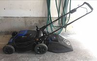 Side view of Kobalt 80V mower with grass bag attached