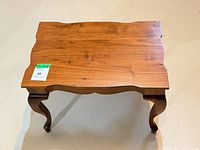 Top view showing scalloped edges and wood grain