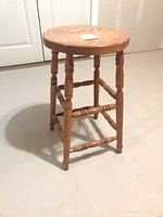 Full view of wooden stool showing overall design and height